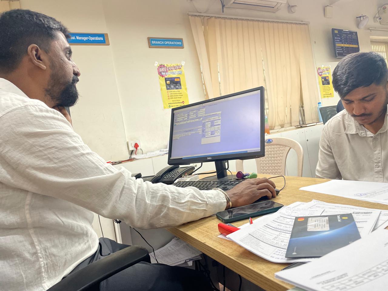 An Orient Exchange branch team using Makez.ai during a live customer transaction